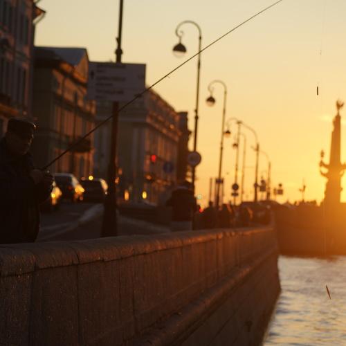 Fisherman on the embankment of the Neva