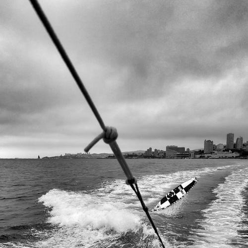 Wake surfing in rainy day
