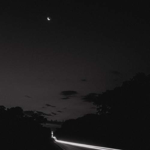 light trail and half moon.