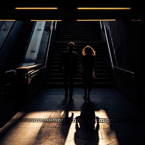 Two people and two shadows.