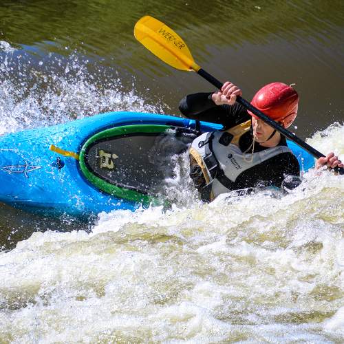 White water action. Rodeo kayaking move.