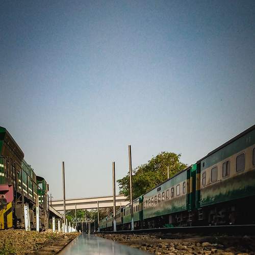 Railway track leads towards destination.