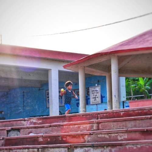 A girl playing with ball ....