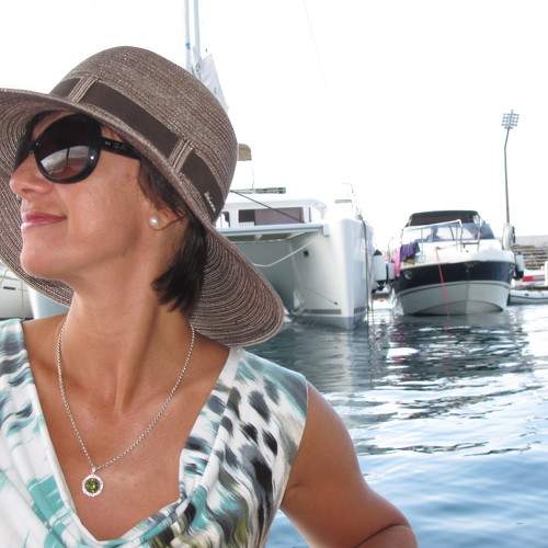 Woman in a hat on a yacht