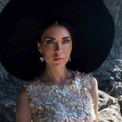 The girl in the hat.