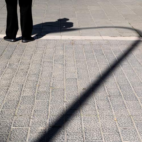 The legs, the shadow and the lamppost
