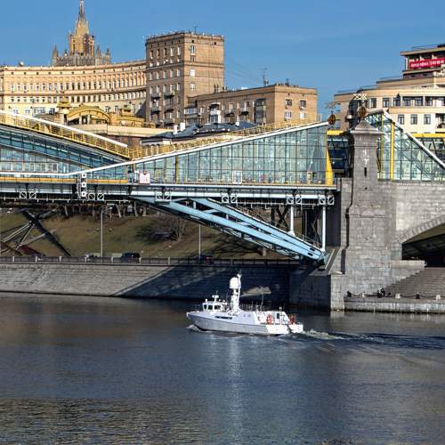 About big and small. A bridge and a small ship.