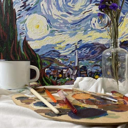 Still life with Vincent van Gogh's Starry Night