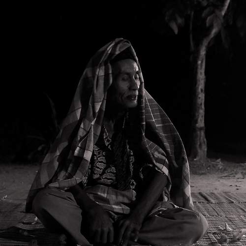 A man is following a traditional healing ritual