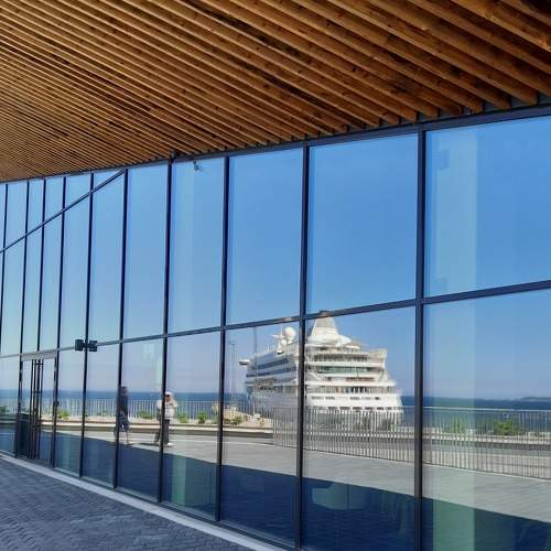 The reflection of the ship in the window.