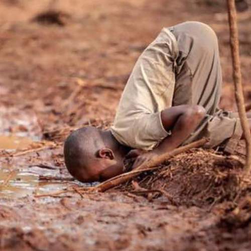 A Child drinking water