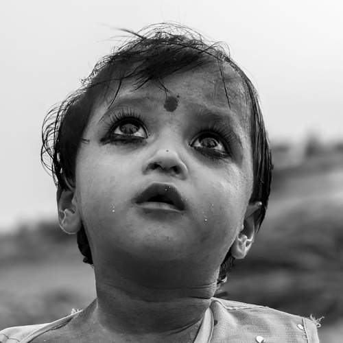 A Child Looking Over The Sky