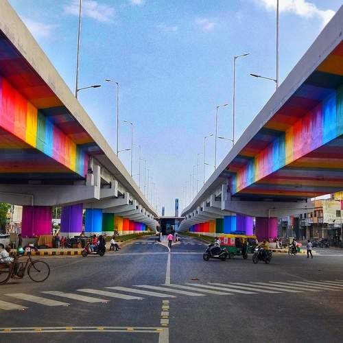 In the fast-paced cityscape, even the pillars break the monotony with colors that speak volumes.