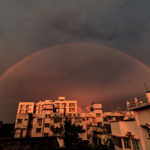 City under the rainbow sky