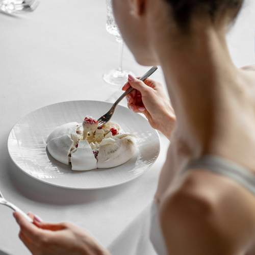 Ballerina eating a Pavlova desert