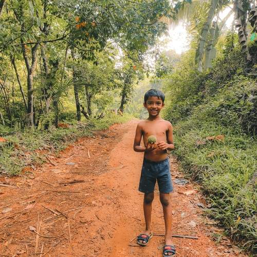 The village boy holding a ball