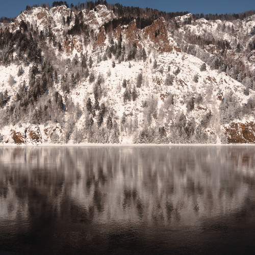 Reflection of mountains in the Enisey river