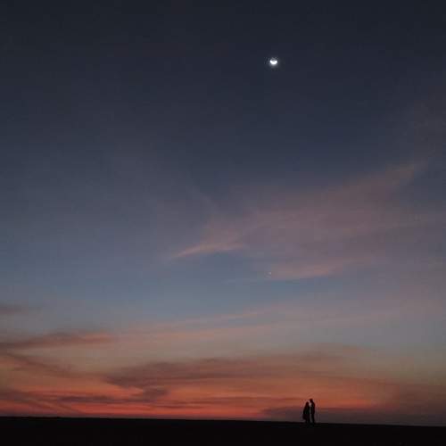 The couple in sunset with moon