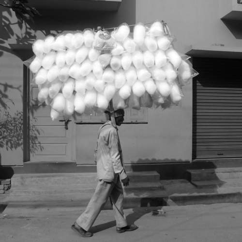 Cotton candy seller in search of customers.