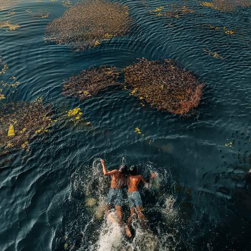 Embracing the joys of childhood: A carefree spirit makes a splash in the water