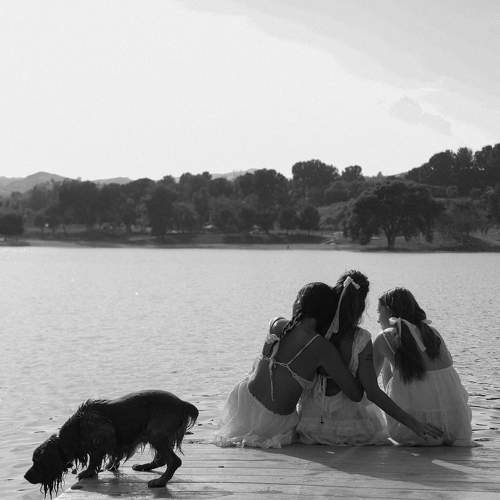 Three girlfriends on the river not counting the dog