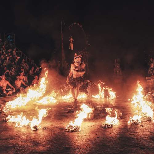 Kecak dancers rush towards the flames without fear