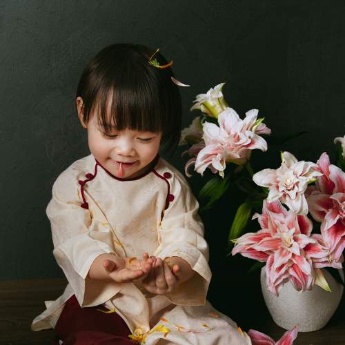 Vietnamese baby with lily flowers