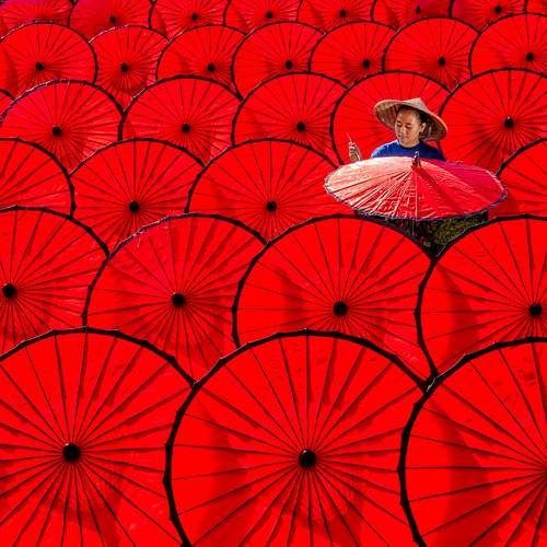Drying The Red Umbrellas
