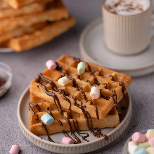photo delicious golden waffles with rich chocolate drizzle and colorful marshmallows
