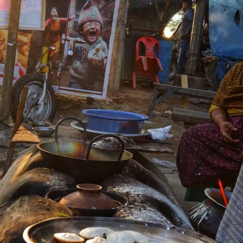 Rustic Morning Warmth: Traditional Pitha Making in Mongla