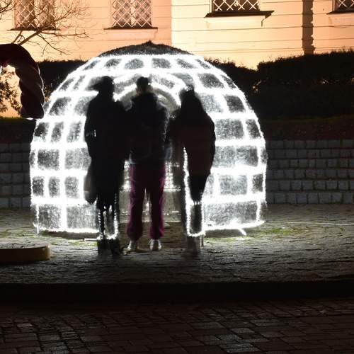 Three young people looked at the igloo
