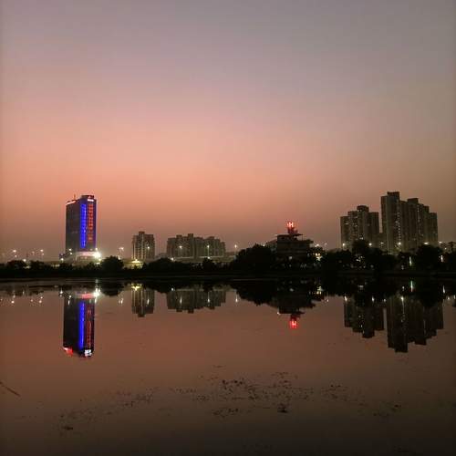 Twilight Reflections | City Lights Meet Still Waters at Dusk