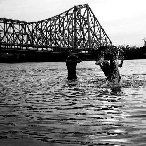 \"Splashes of Joy Beneath the Howrah bridge \"