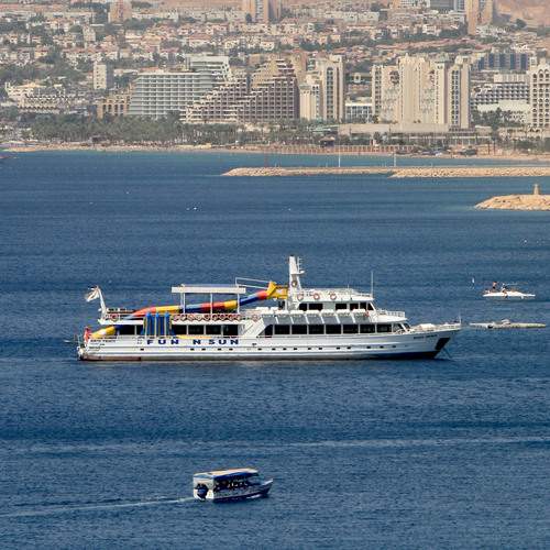 A tourist boat stands in the Gulf of Aqaba