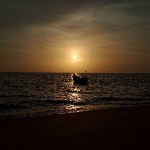 Beautiful Sunset and Fishing Boat