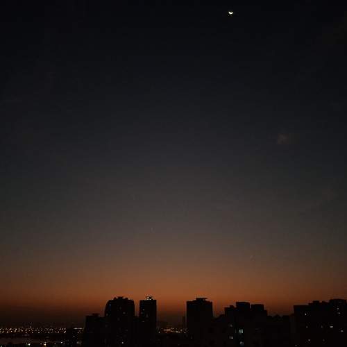 Sunset with Half Moon