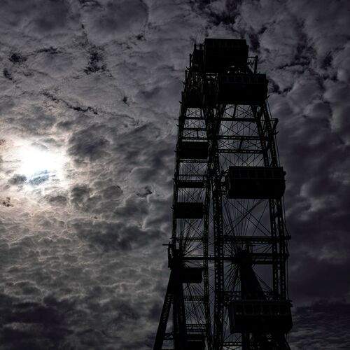 Ferris wheel in silhouette