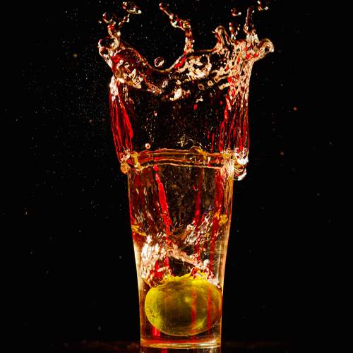 a lemon in a glass of water