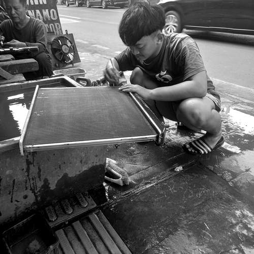 Man cleaning radiator