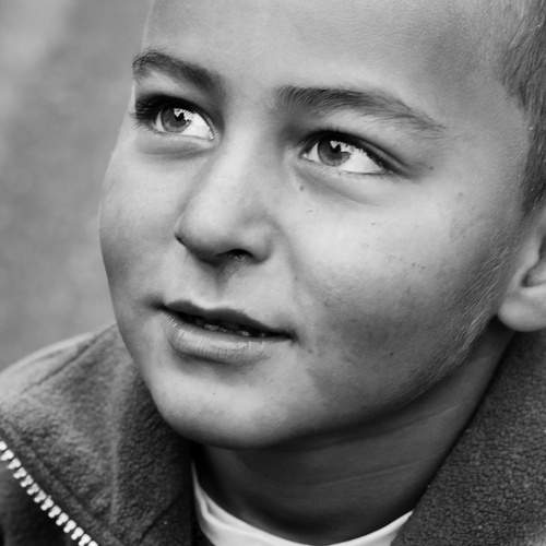 Black and white portrait of a young boy