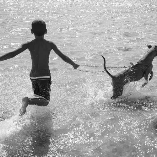 Boy playing on the beach.