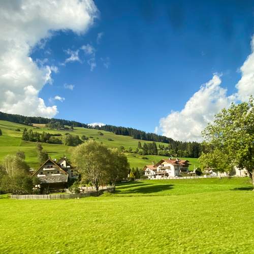 Clouds over a green plain