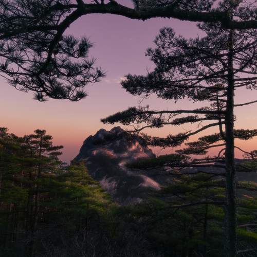 Twilight dyes the mountain peaks