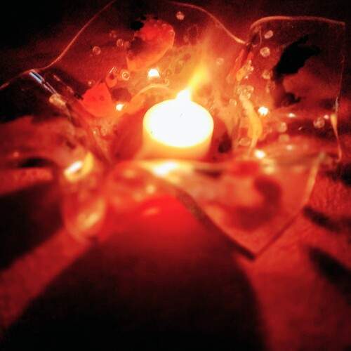 Vela en capelina de vidrio.