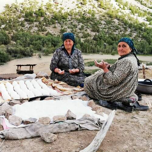 Women in Tajikistan\'s mountains making Kurut, SaryDag area