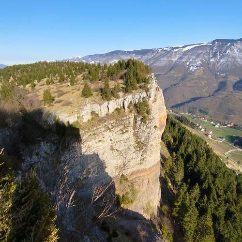 Majestic Cliffside Plateau Overlooking a Remote Mountain Valley