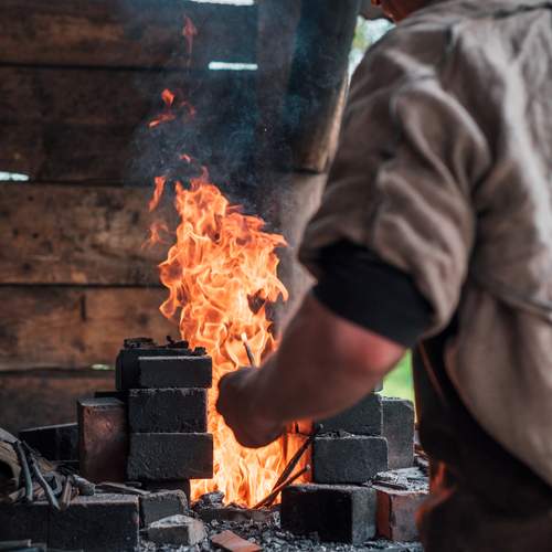 Tongues of flame in an ancient forge.