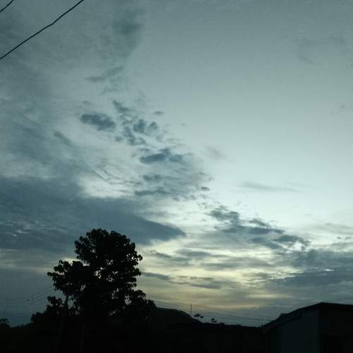 Moody Evening Sky Over Rural Silhouette.