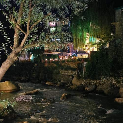 Riverside Reflections After Dark
