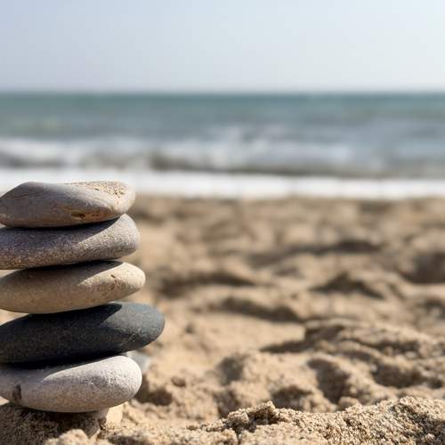 Serene Seaside Scene Featuring Orderly Pebbles And Warm Tones For Meditation